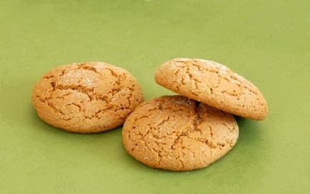 Oatmeal cookies three fresh appetizing oatmeal cookies over green background