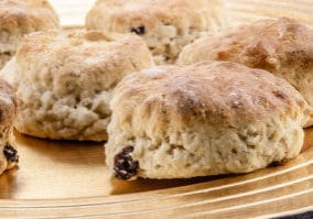home made raisins scones on a plate